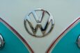 A detailed close-up of a vintage Volkswagen emblem on a classic van, showcasing retro design.